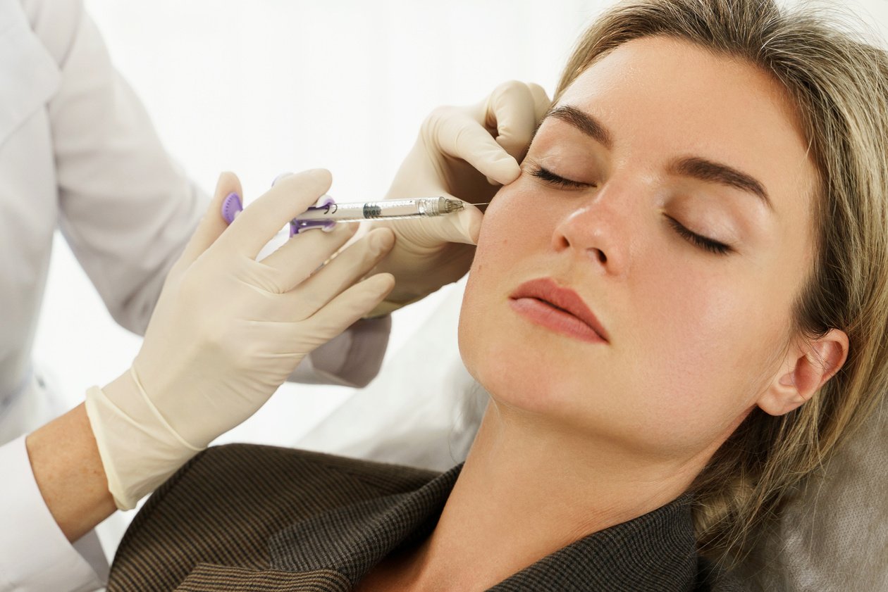 Woman during Facial Filler Injections in Aesthetic Medical Clini